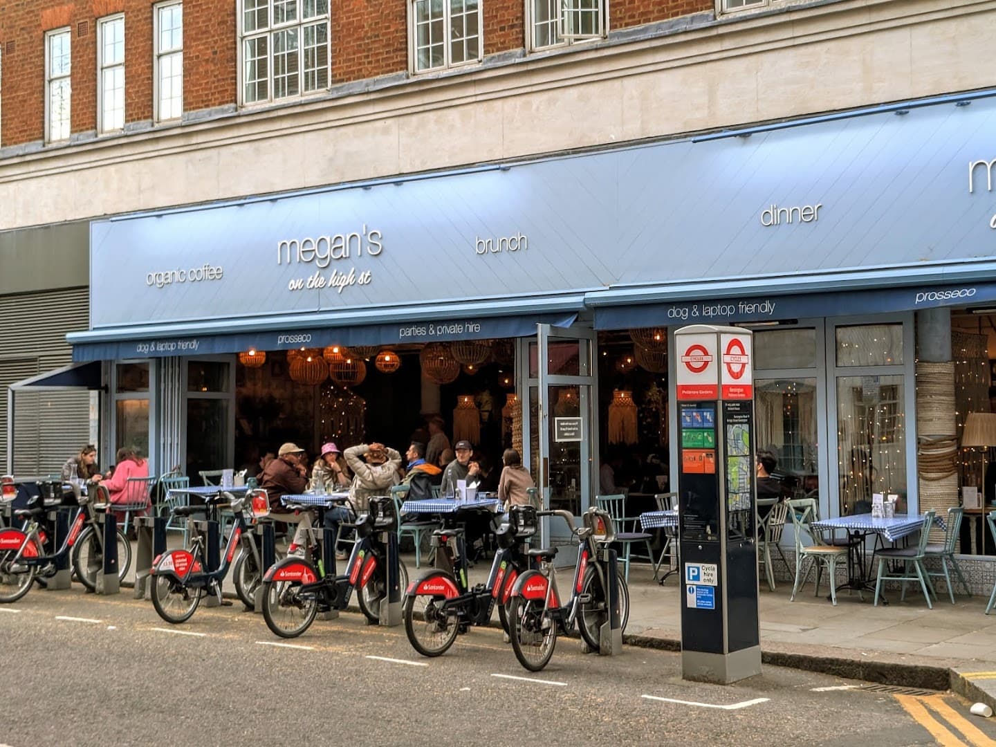 Front facade with outdoor seating at Megan's on the High Street Restaurant, Kensington, London
