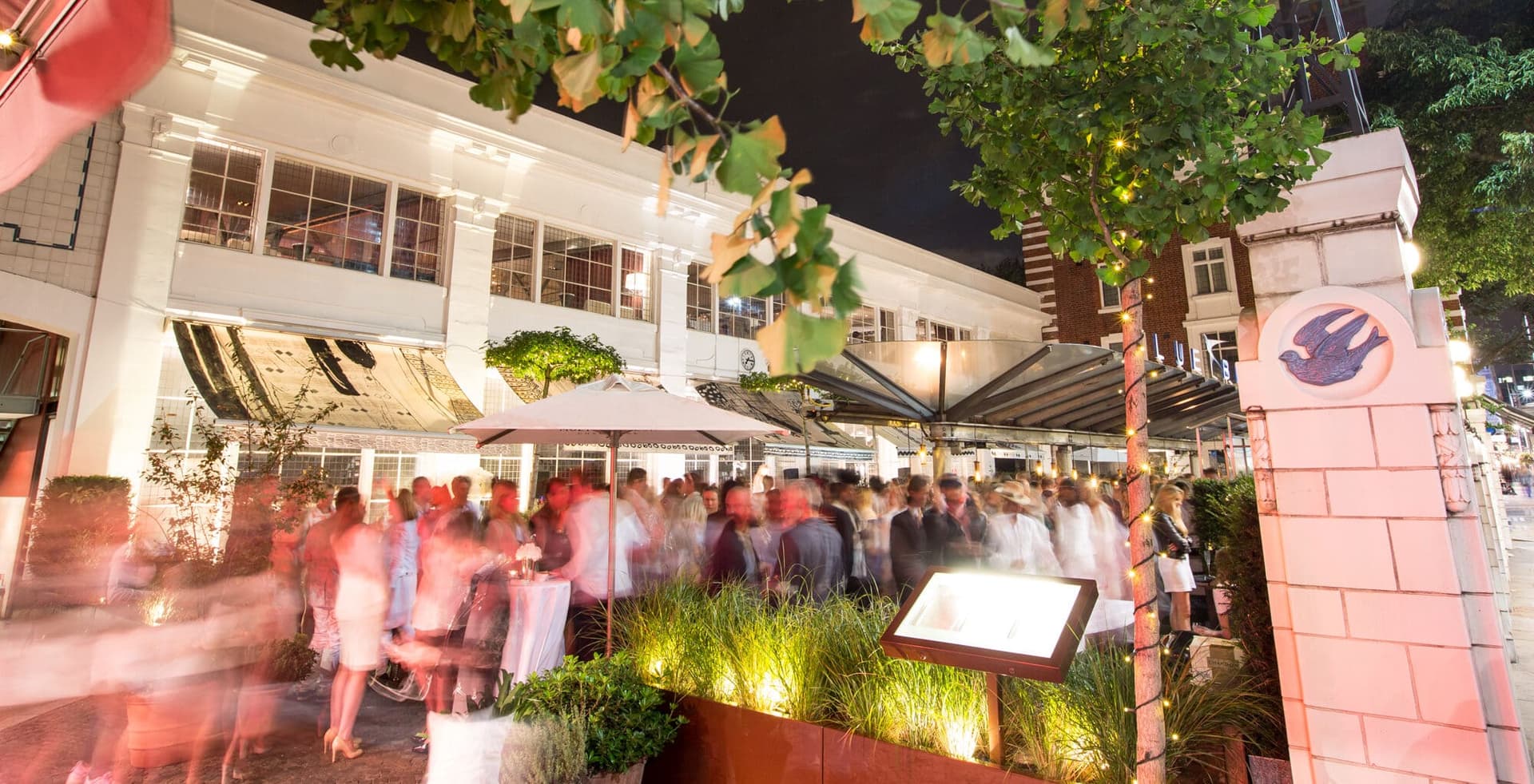 Evening courtyard event at Bluebird Chelsea, London