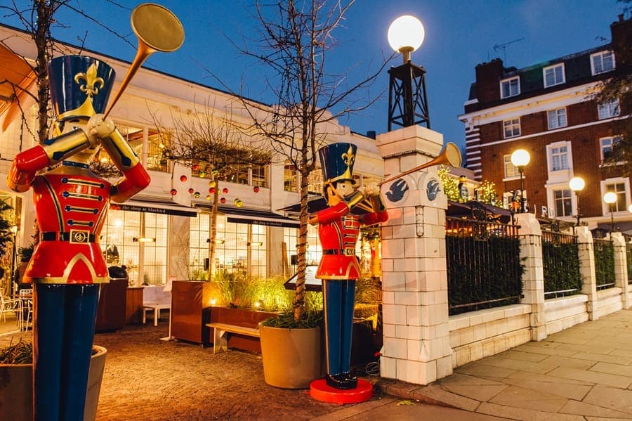 Festive entrance with toy soldier decorations at Bluebird Chelsea, London