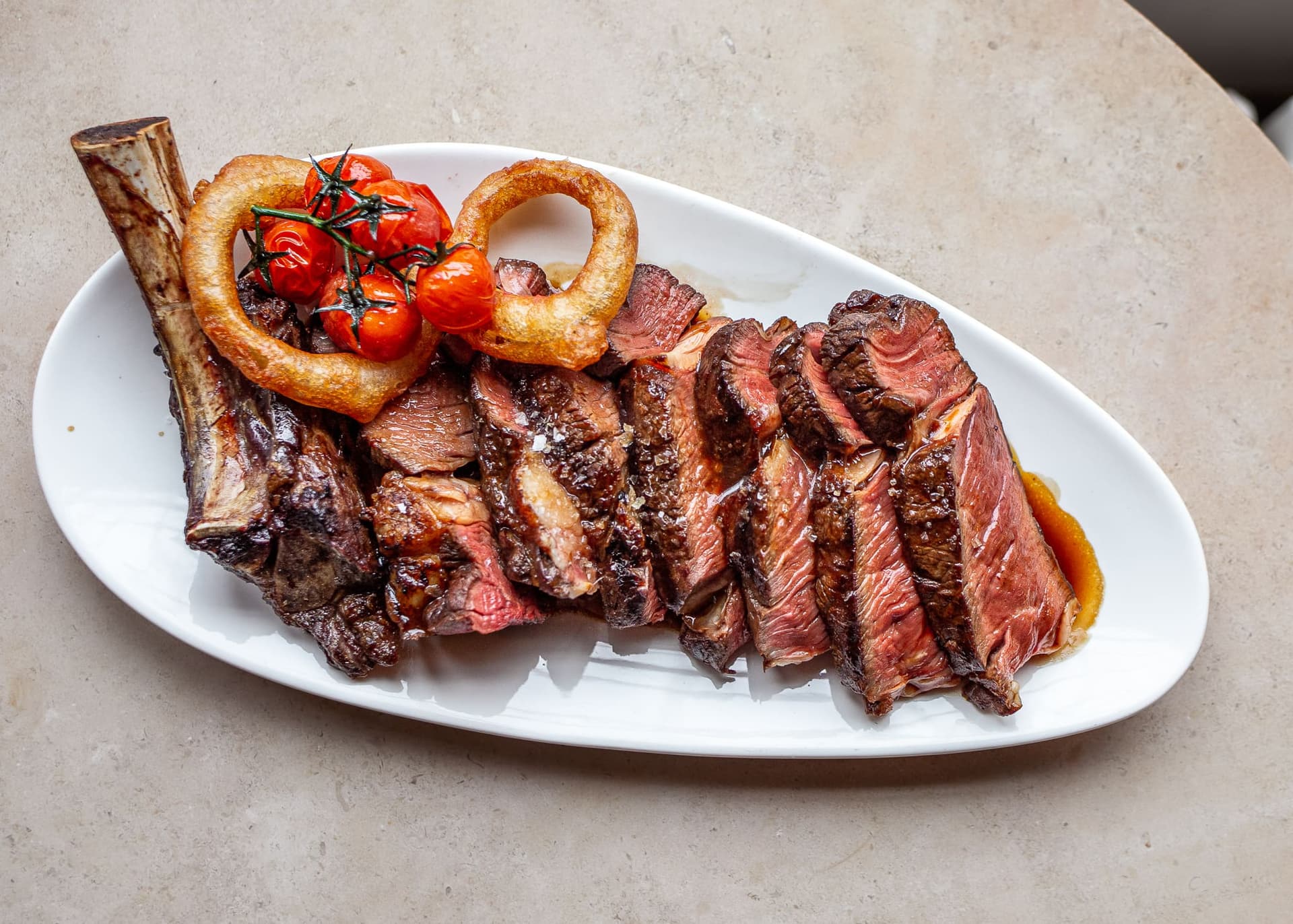 Sliced ribeye steak at Bluebird Chelsea, London