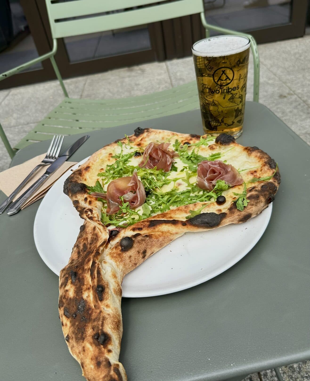 Artisan pizza with prosciutto and rocket at Mercato Mayfair, London