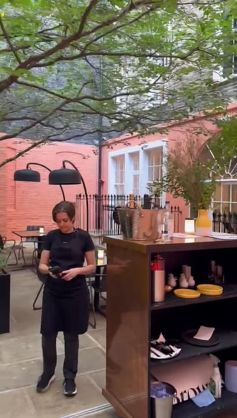 Outdoor courtyard seating at 123V Browns, London