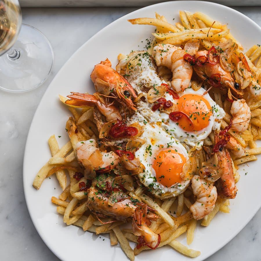 Seafood fries with fried eggs at Pizarro, London