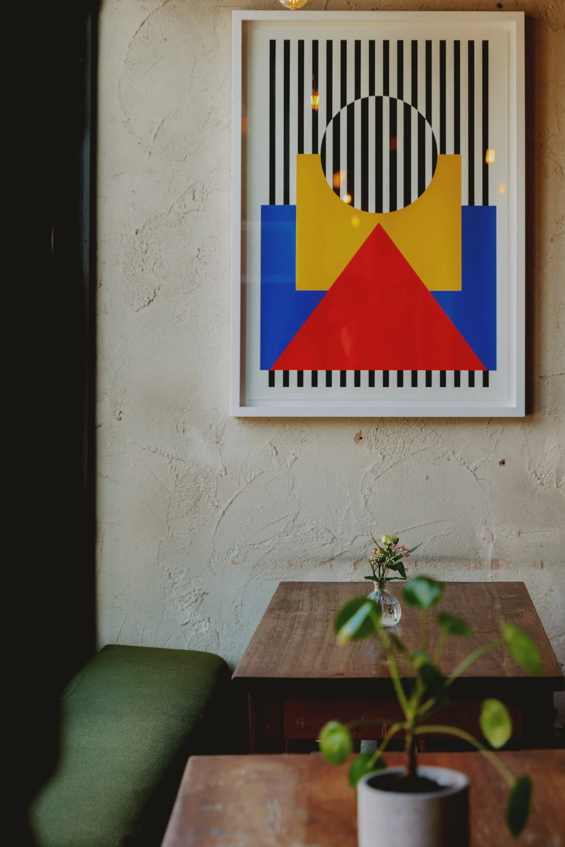 Seating area with geometric artwork at Alice House West Hampstead, London
