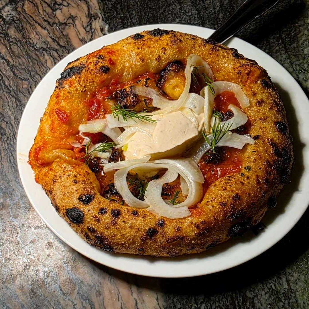 Wood-fired pizza at Roe, Canary Wharf, London