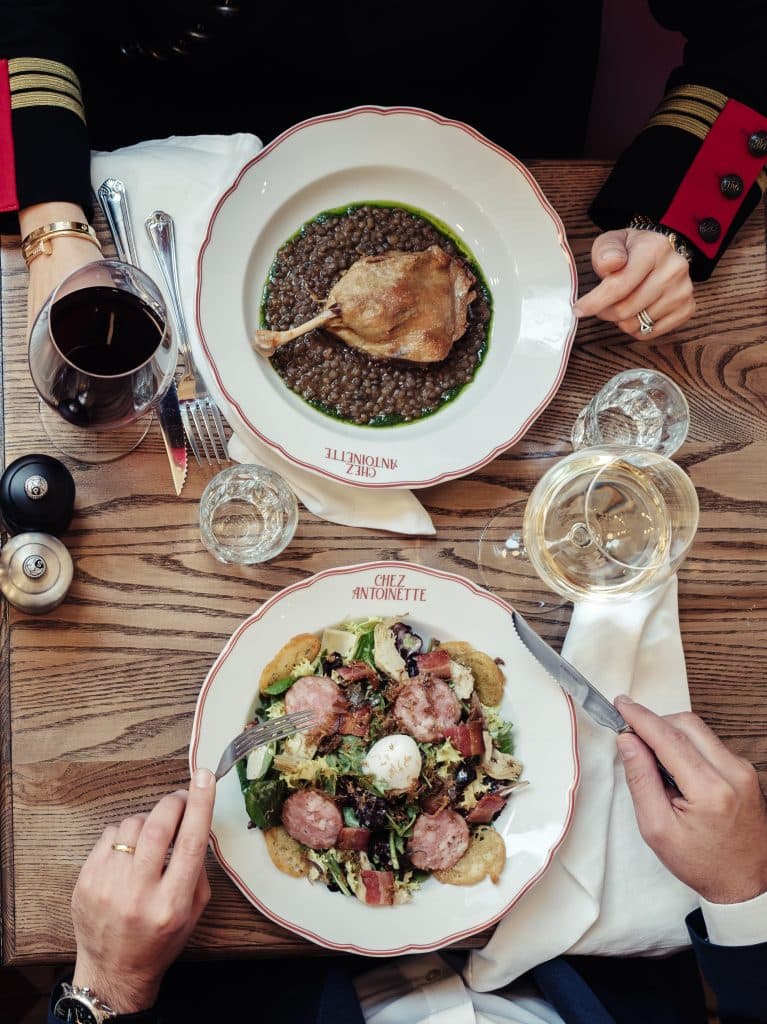 Duck confit with lentils and Lyonnaise salad at Chez Antoinette Victoria, London