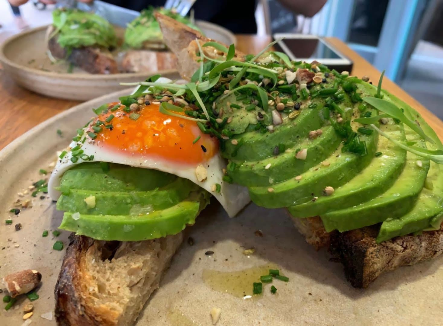 Avocado toast with fried egg at 26 Grains, London