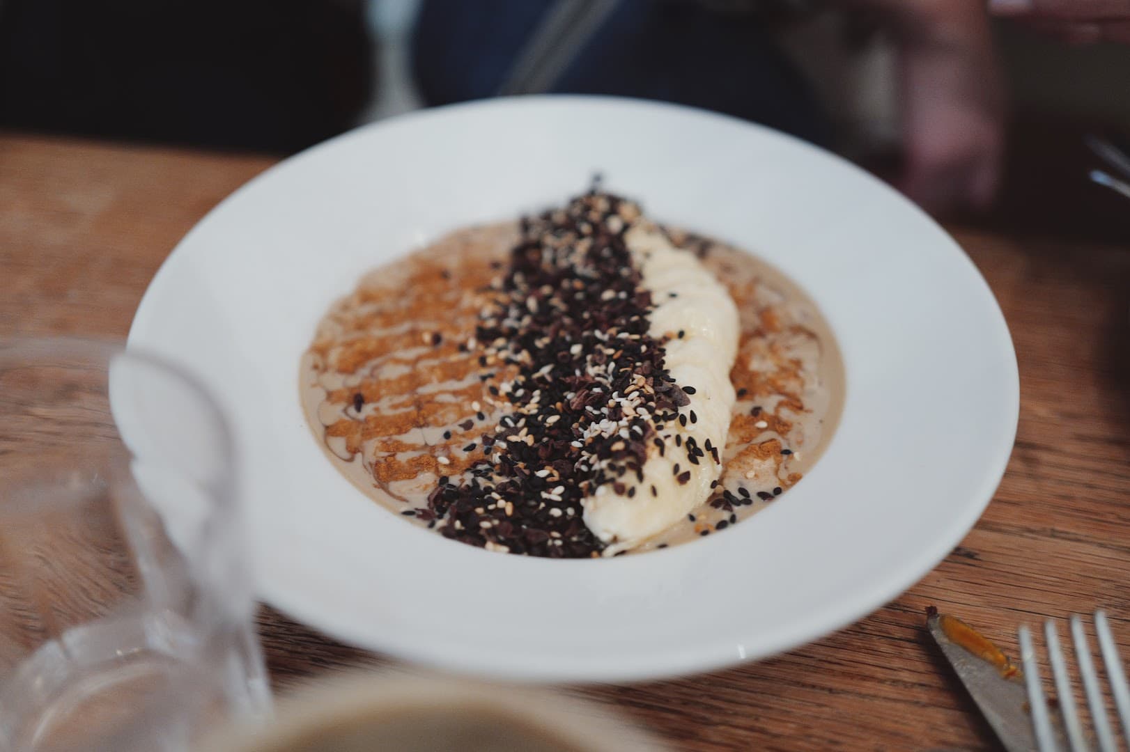 Porridge bowl with sesame seeds at 26 Grains, London