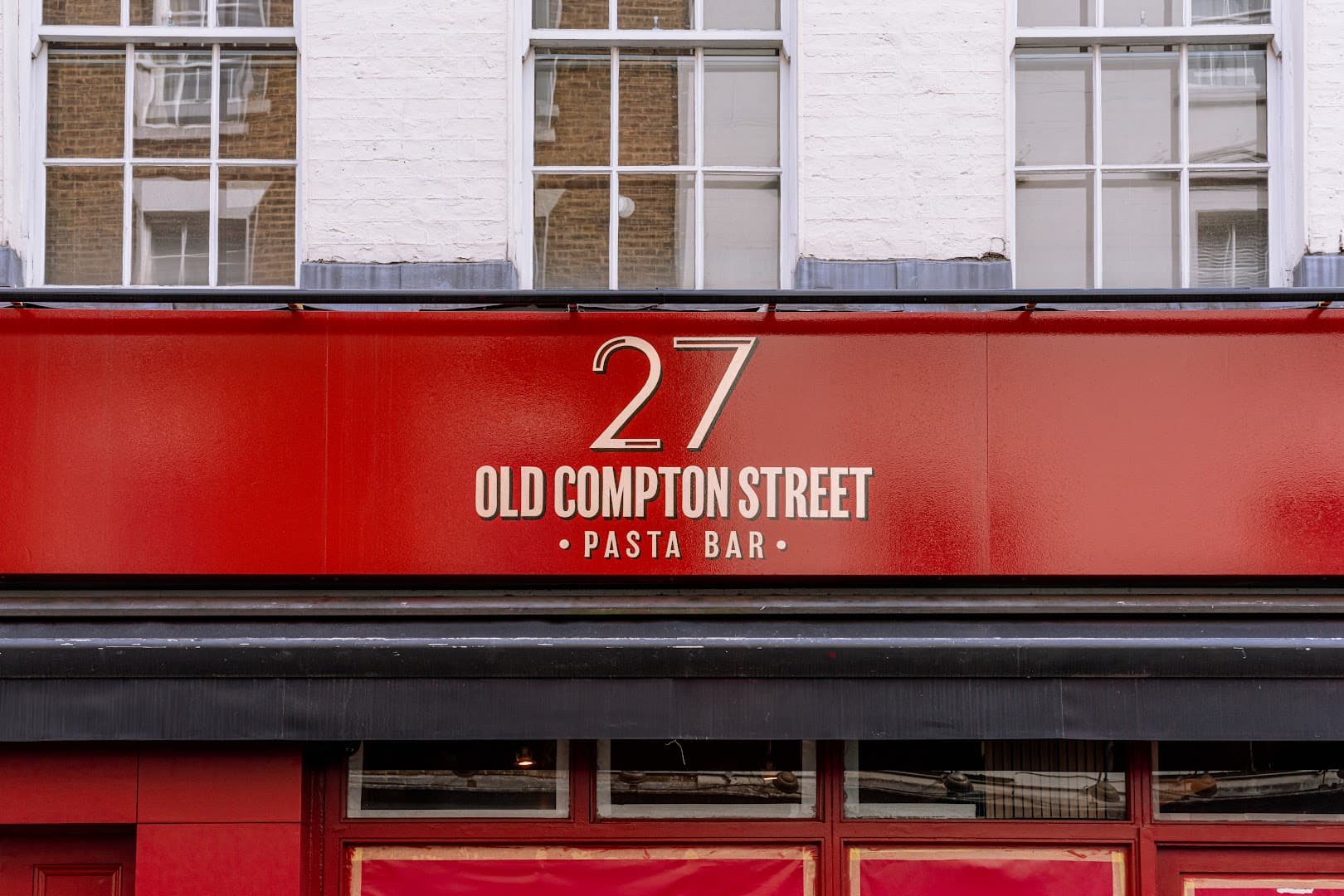 Front facade signage at 27 Old Compton Street, Soho, London