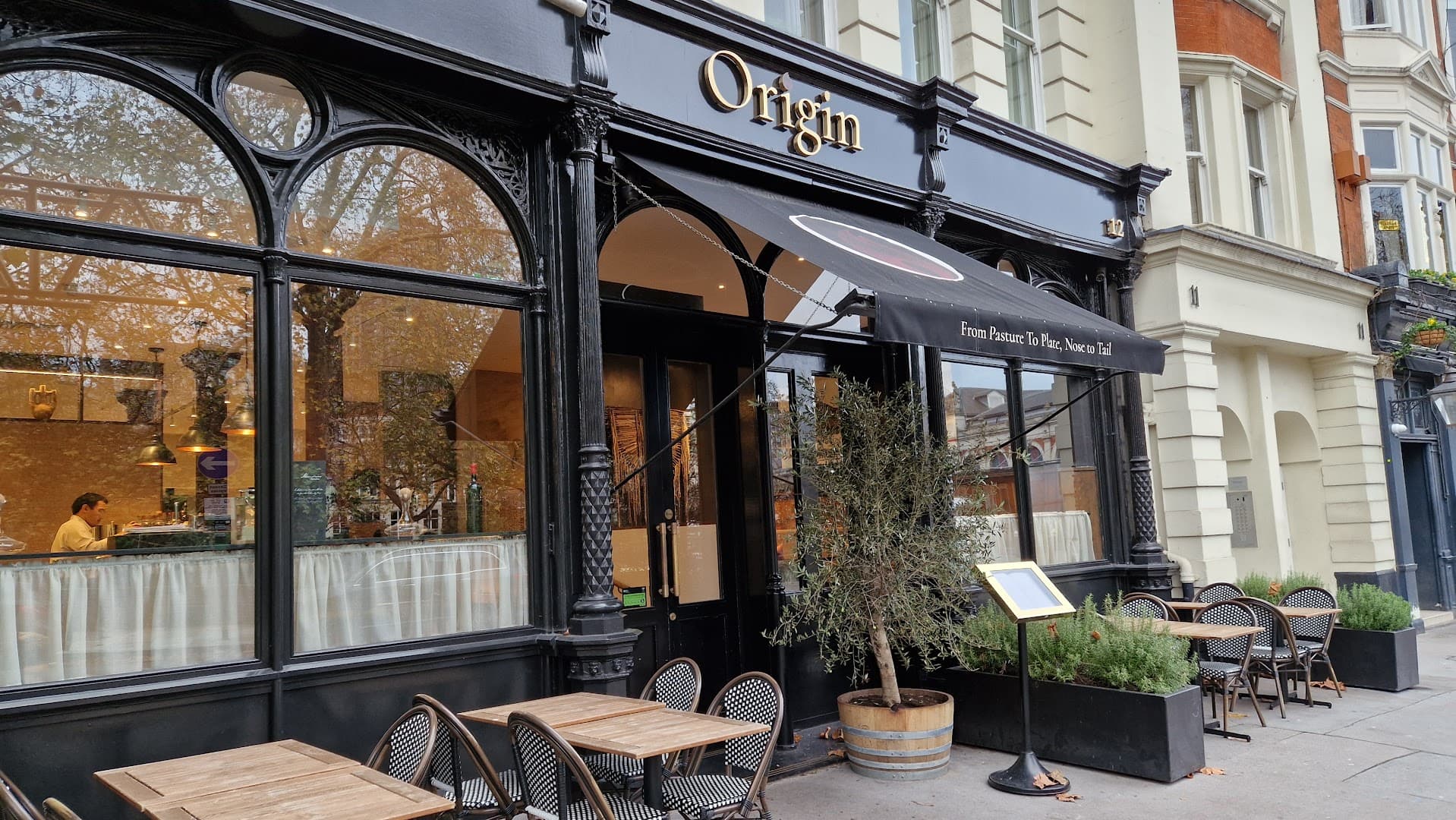 Front facade with outdoor seating at Origin City, London