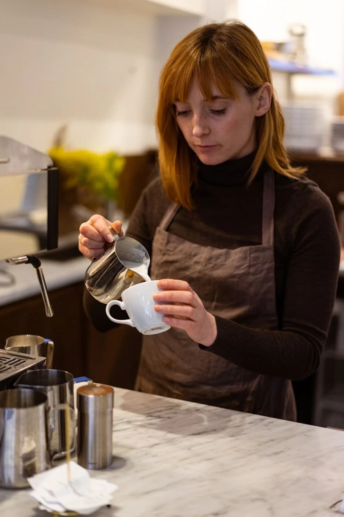 Barista preparing coffee at Potter & Reid, London