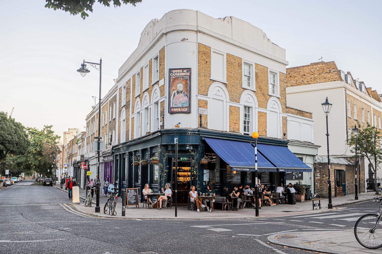 Corner building with outdoor seating at The Duke Organic, London