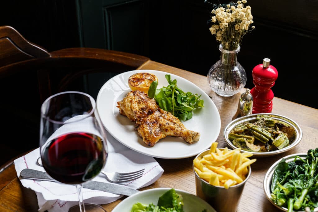 Roast chicken dining spread at The Thomas Cubitt Pub, Belgravia, London