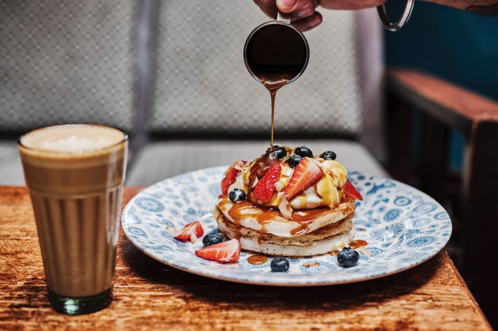 Pancakes with syrup and berries at Dishoom Battersea, London