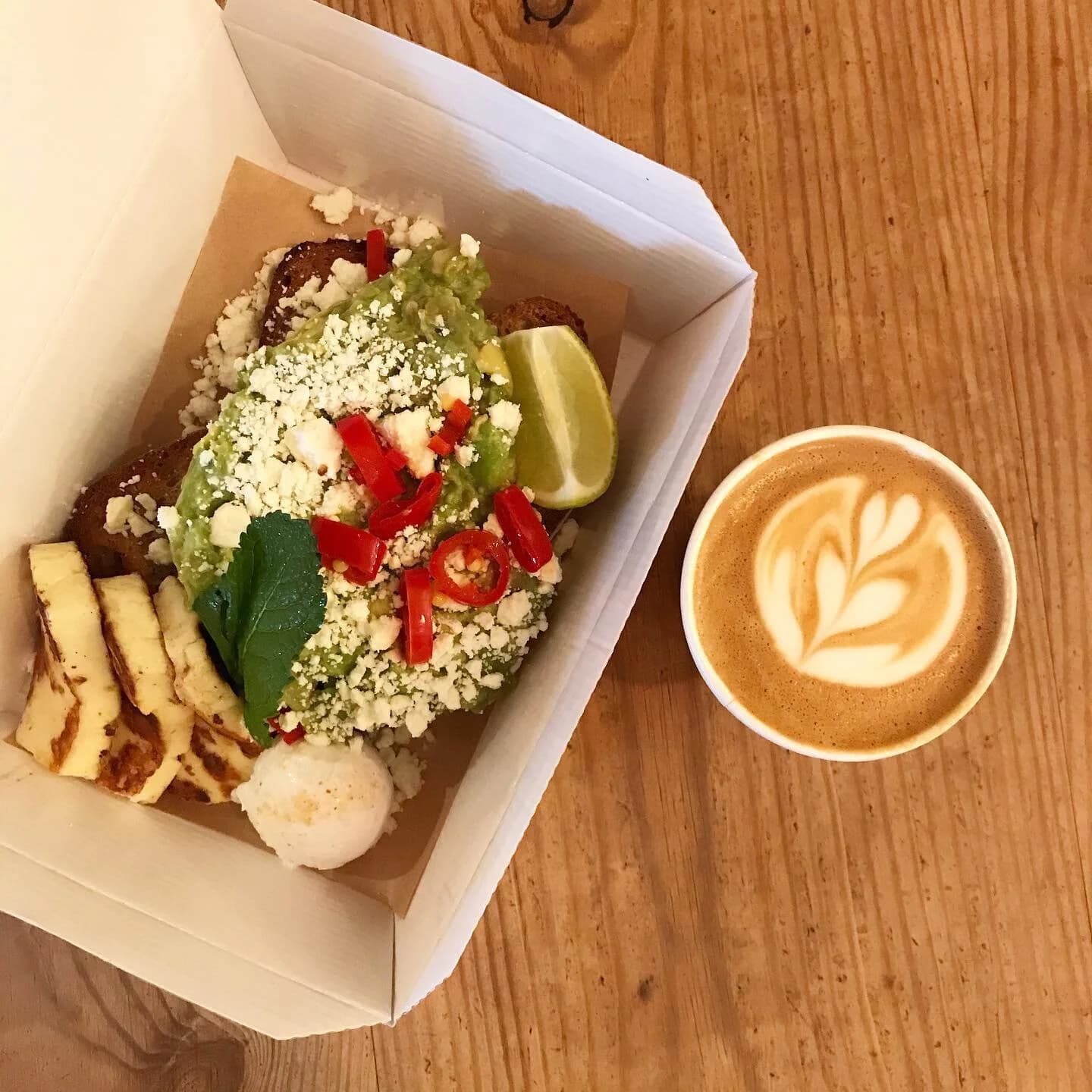Brunch box with latte at Flotsam & Jetsam, London