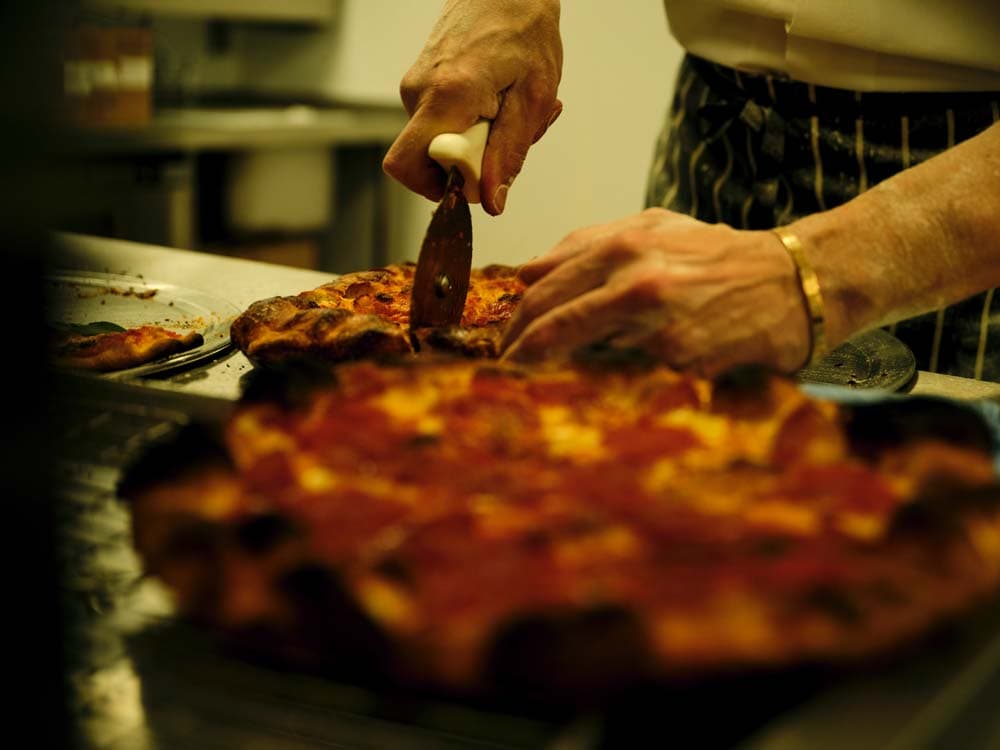 Pizza preparation at Crisp W1, London