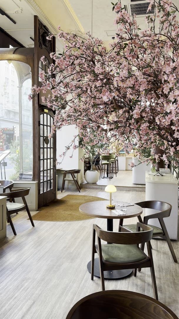 Cherry blossom dining area at Wolfox Savoy London, London