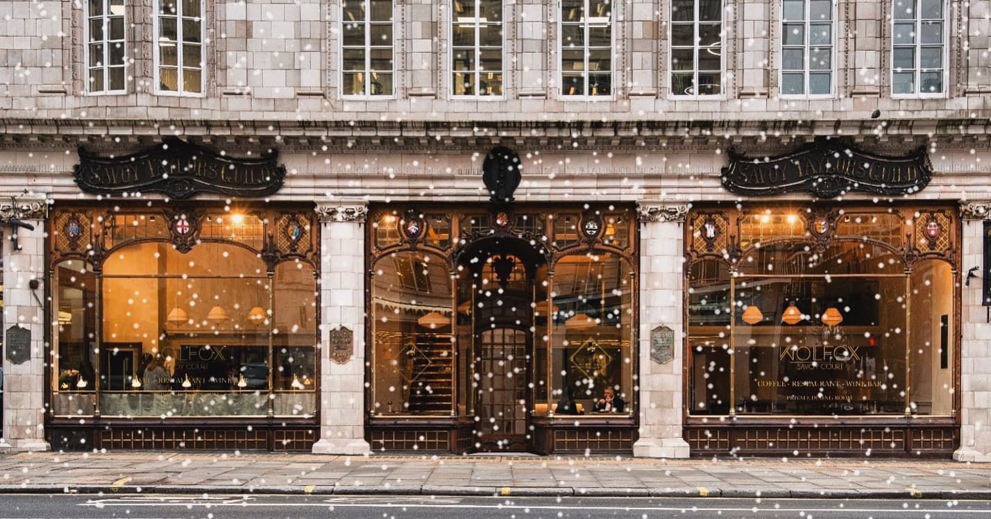 Snowy winter facade at WOLFOX Savoy London, London