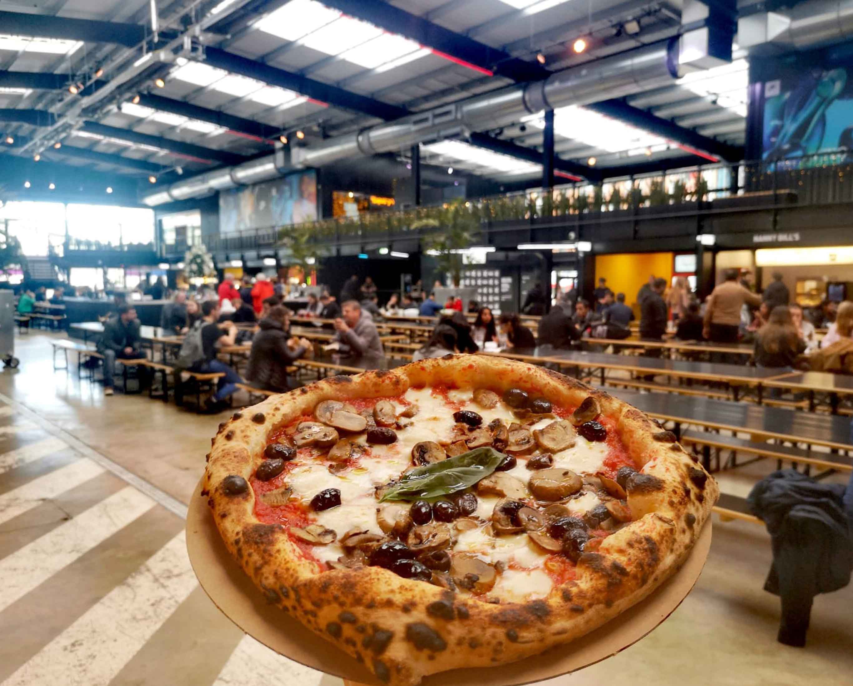 Pizza in food hall setting at Zia Lucia - West Hampstead, London