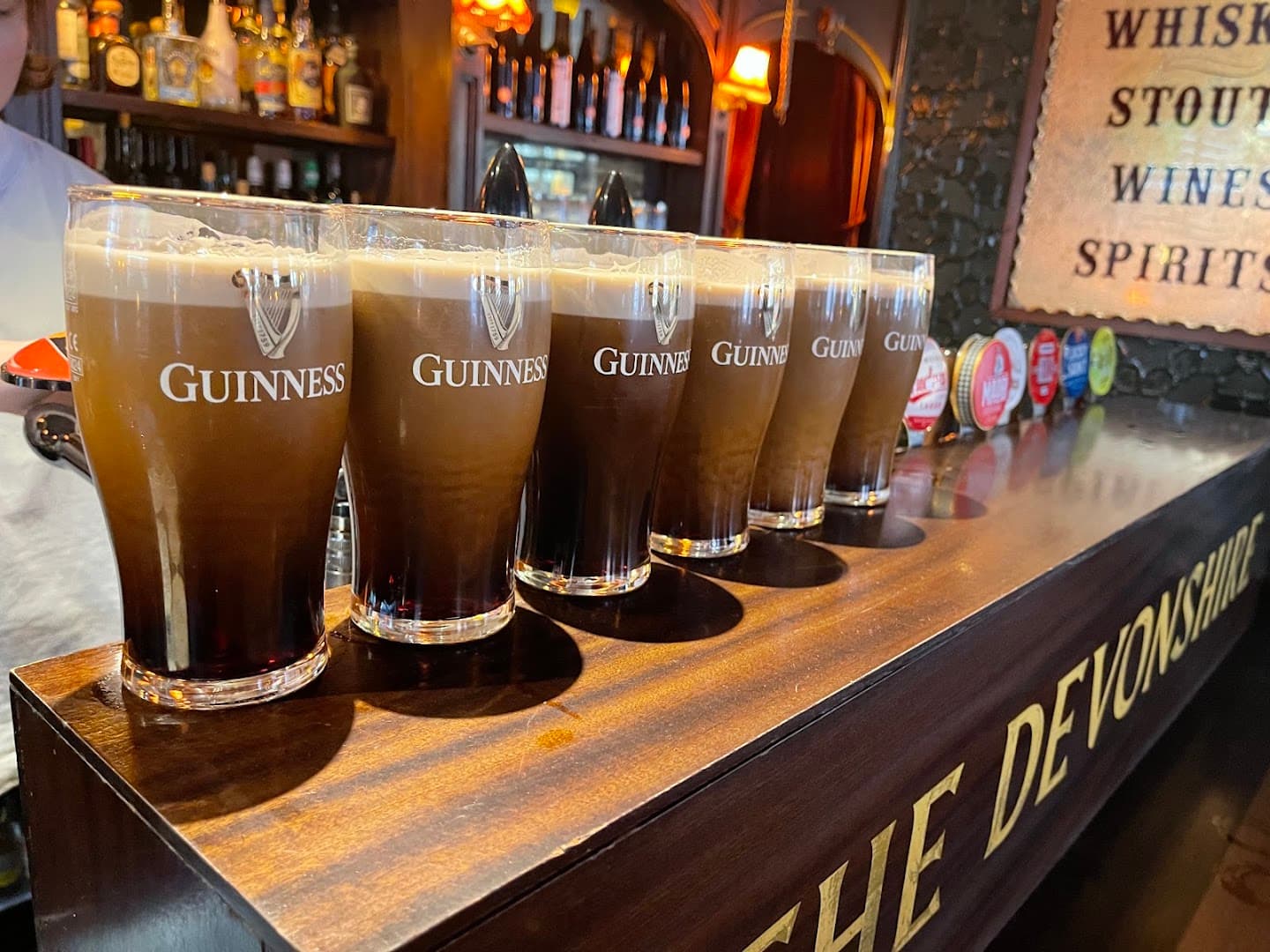 Bar with Guinness pints at The Devonshire, London