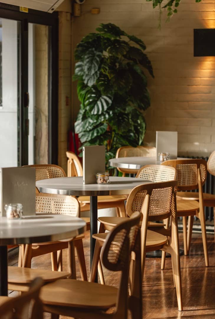 Dining area with cane chairs at The Waterway, London