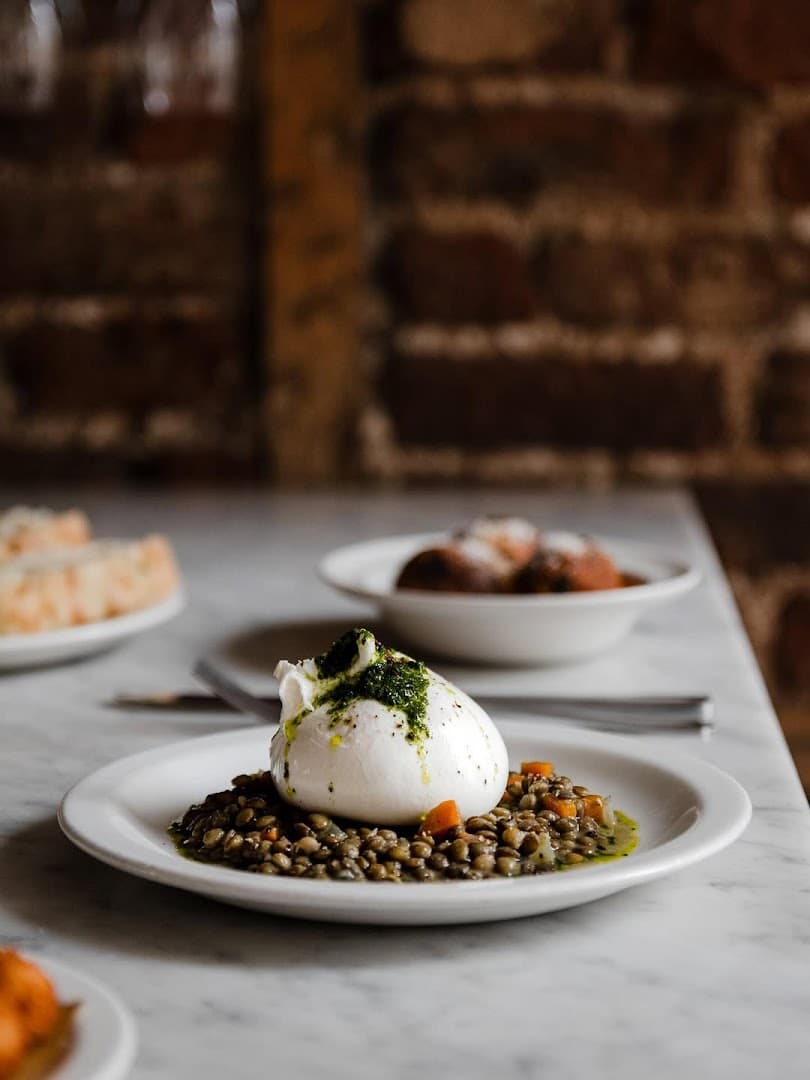 Burrata and lentils dish at POLPO Italian Restaurant Chelsea, London