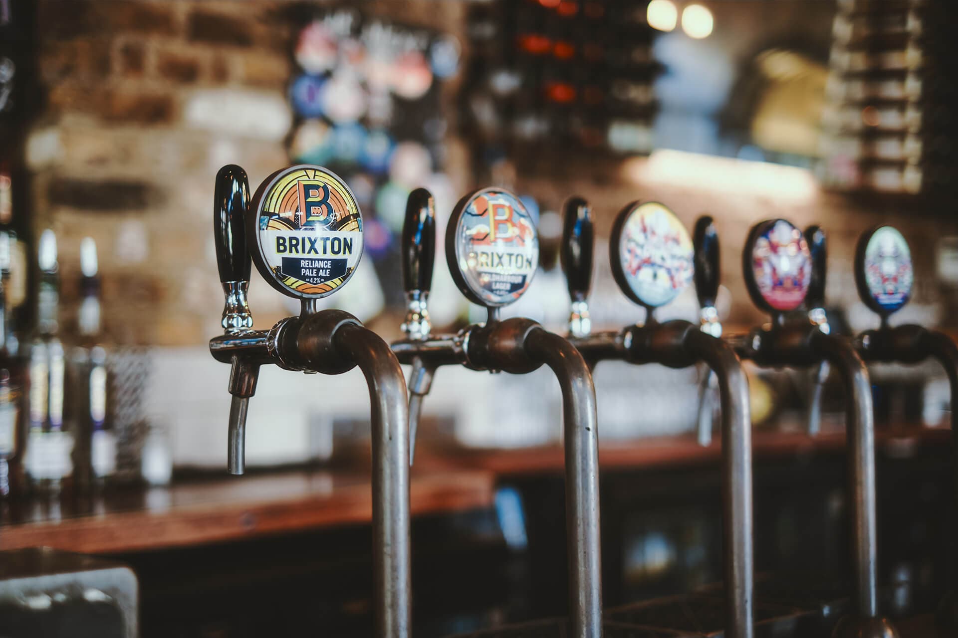 Bar area beer taps at Crown & Anchor, London