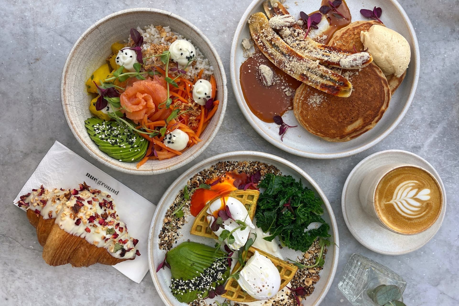 Brunch menu spread at Nue Ground Cafe, London