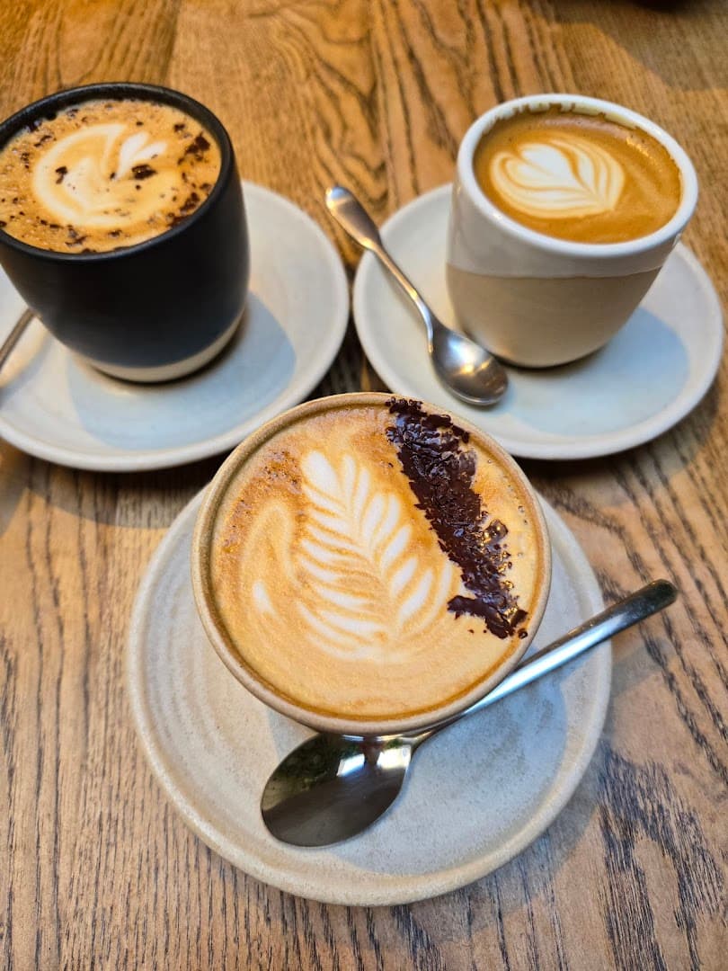 Latte art coffees at Nue Ground Cafe, London