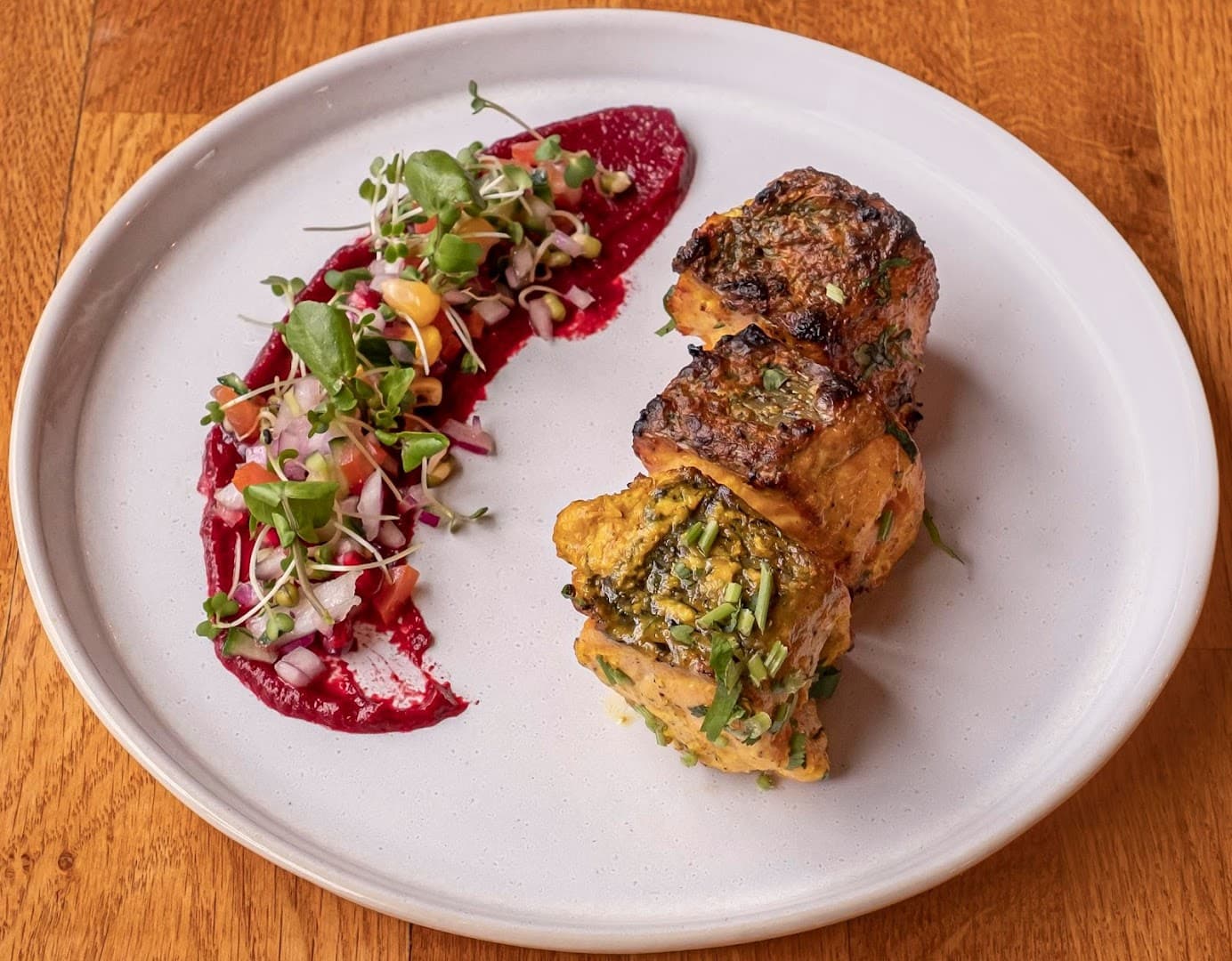 Herb-crusted pork loin with beetroot purée at Three Falcons Hotel & Pub, London