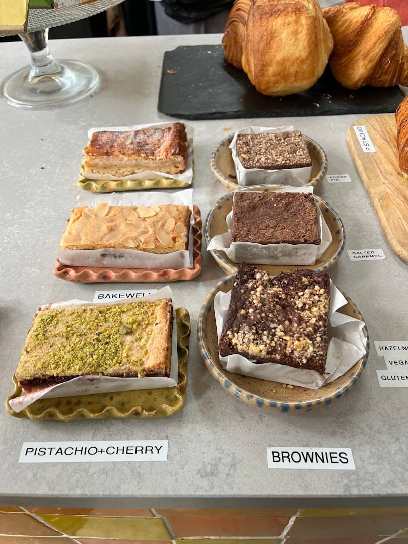 Pistachio cherry cake and brownies display at Bake Street, London