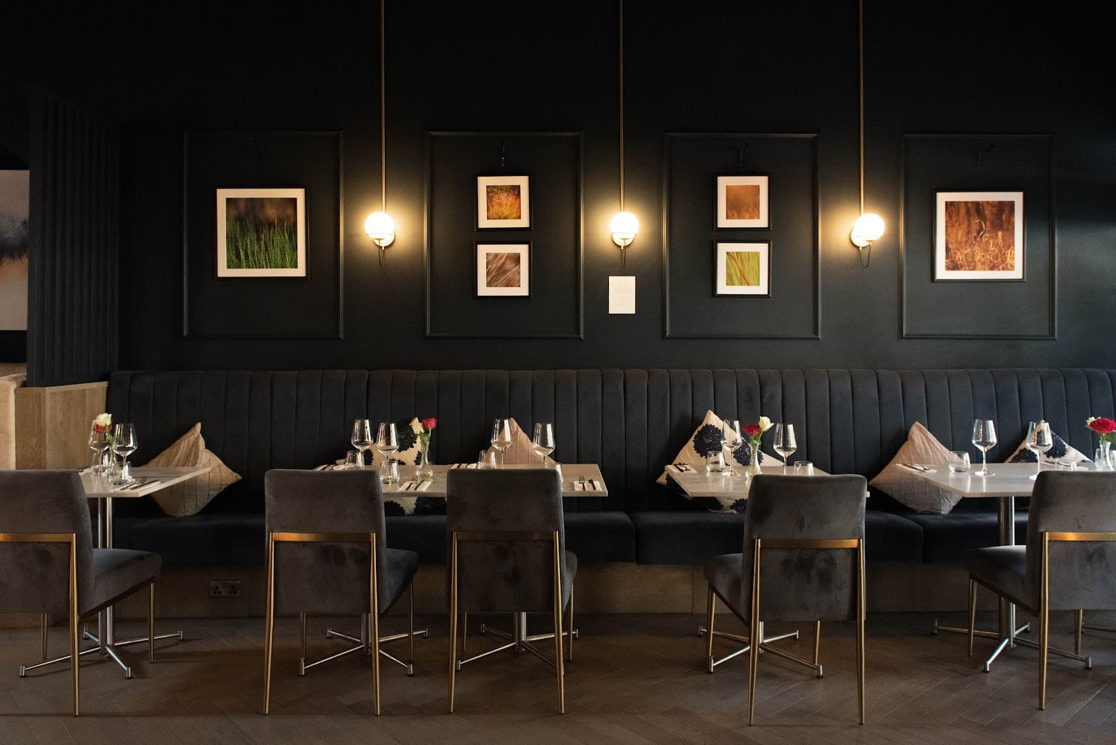 Elegant dining room with banquette seating at Flame & Fire, London