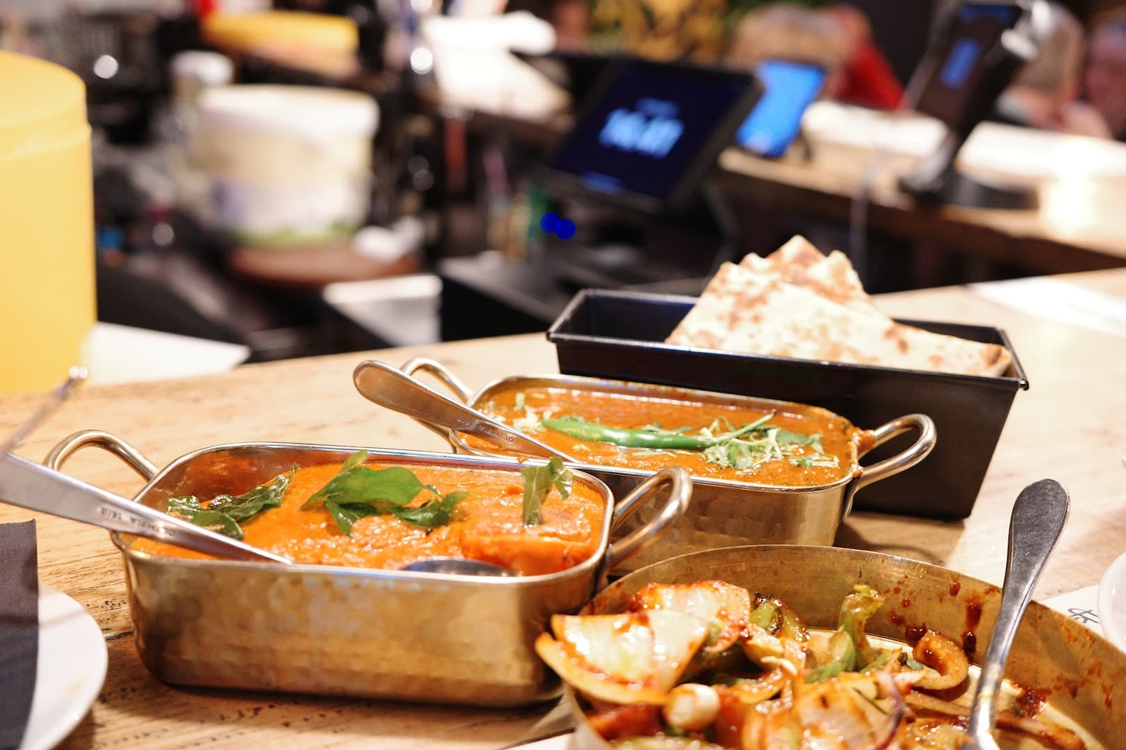 Curry dishes table presentation at Yatri Indian Restaurant, London