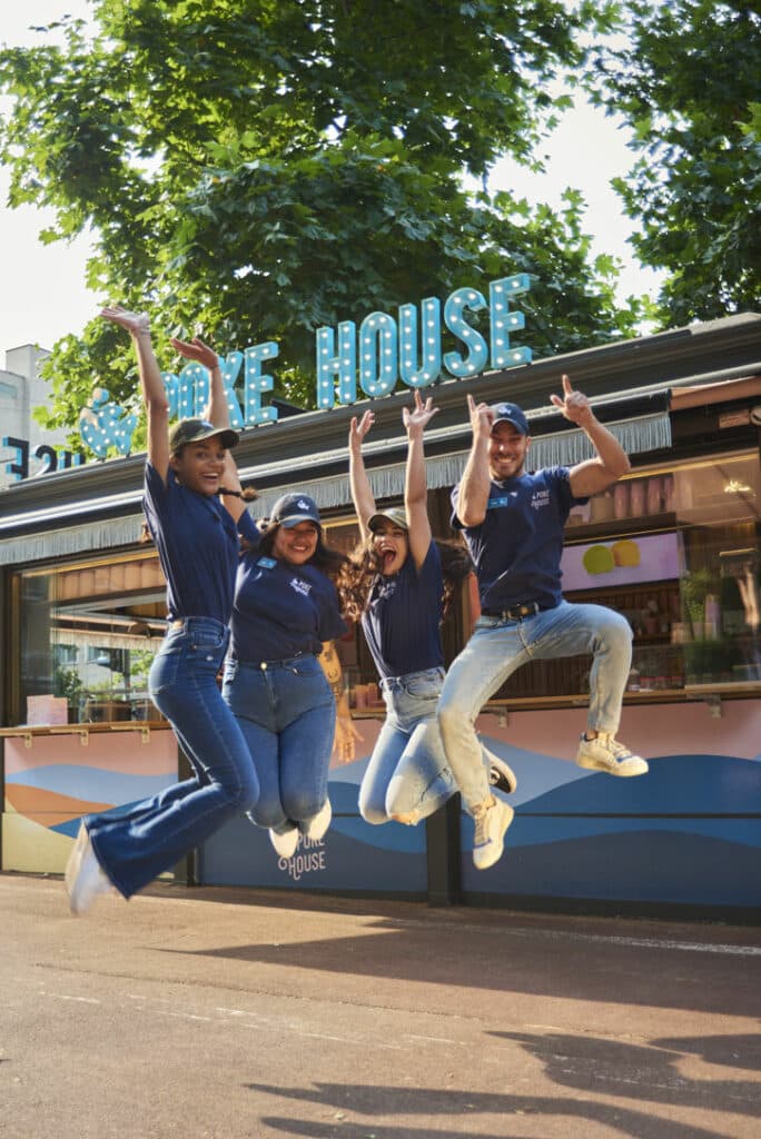 Team photo at Poke House exterior, Battersea Power Station, London