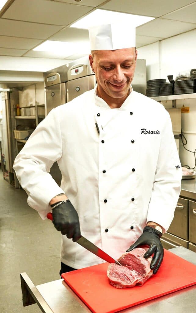 Chef Rosario preparing steak at Mr. Steak Hammersmith, London