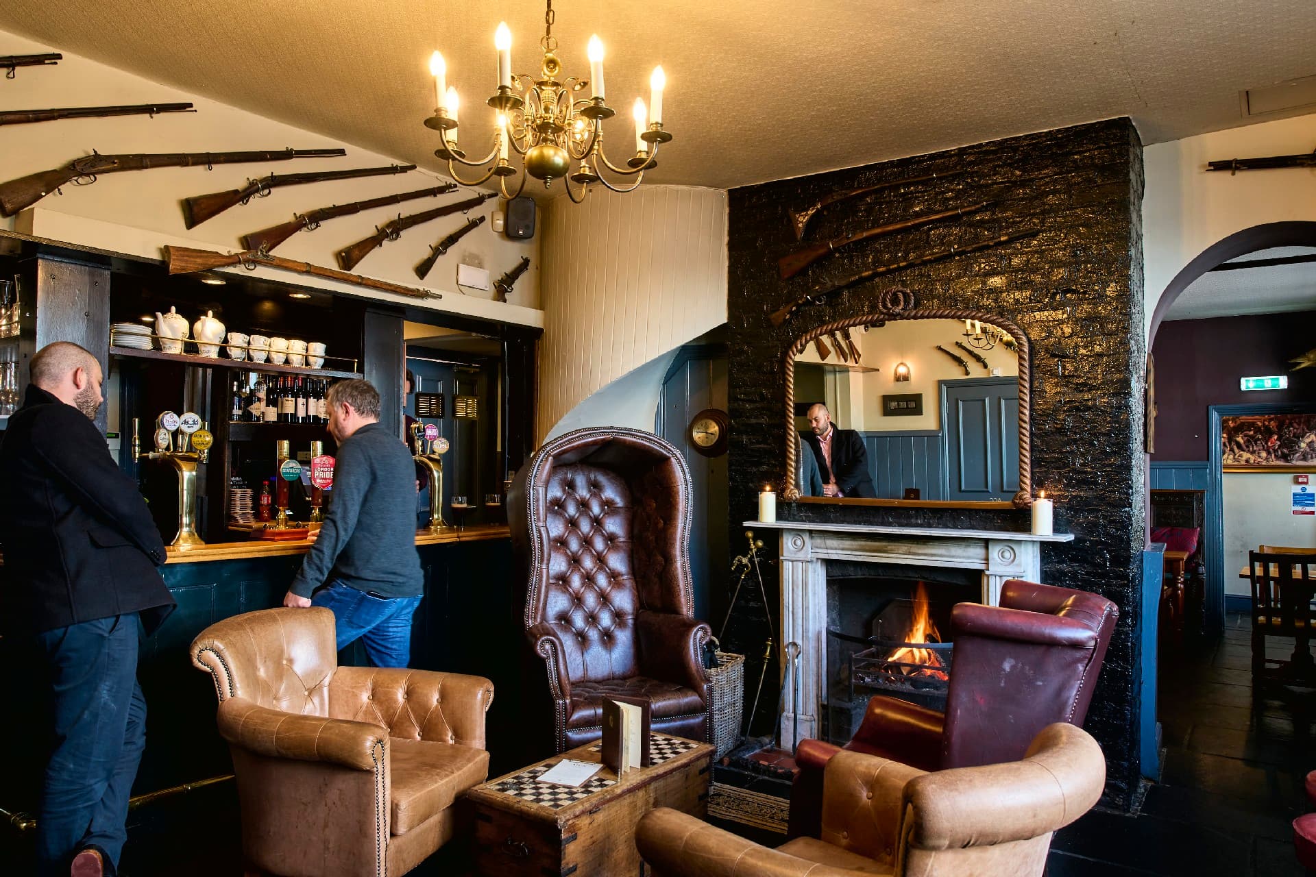 Bar area with fireplace at The Gun, Docklands, London