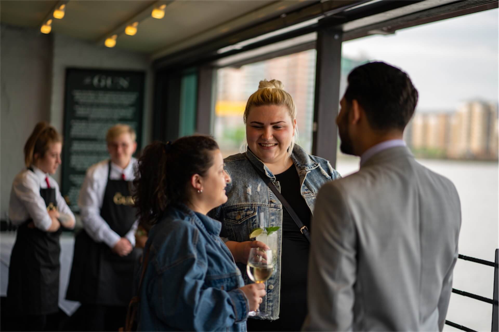 Bar area guests enjoying drinks at The Gun, Docklands, London
