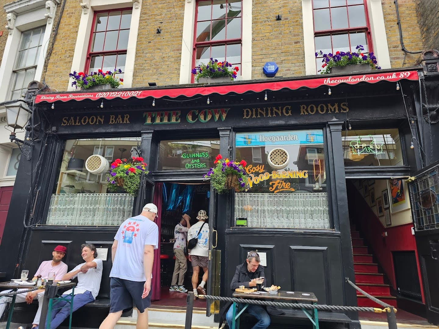 Front facade with outdoor seating at The Cow, London