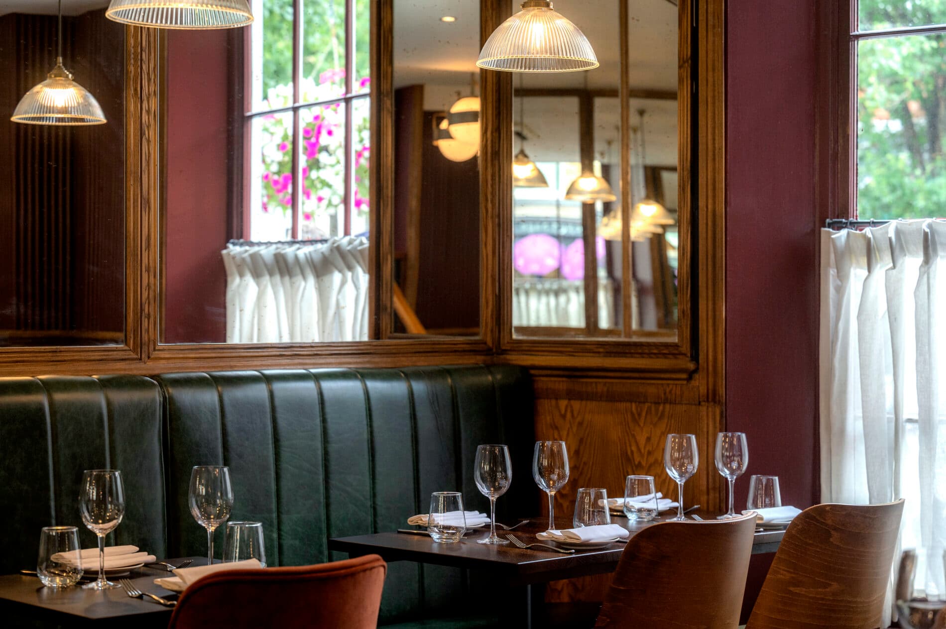 Elegant dining room with booth seating at The Hunter's Moon, London