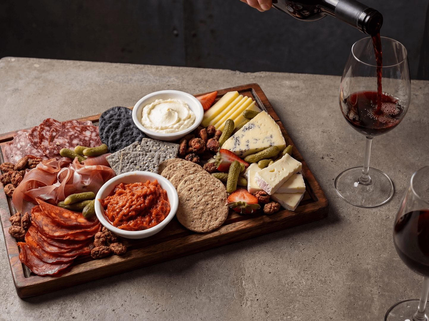 Charcuterie board with wine at Burnt Umber Brasserie, London