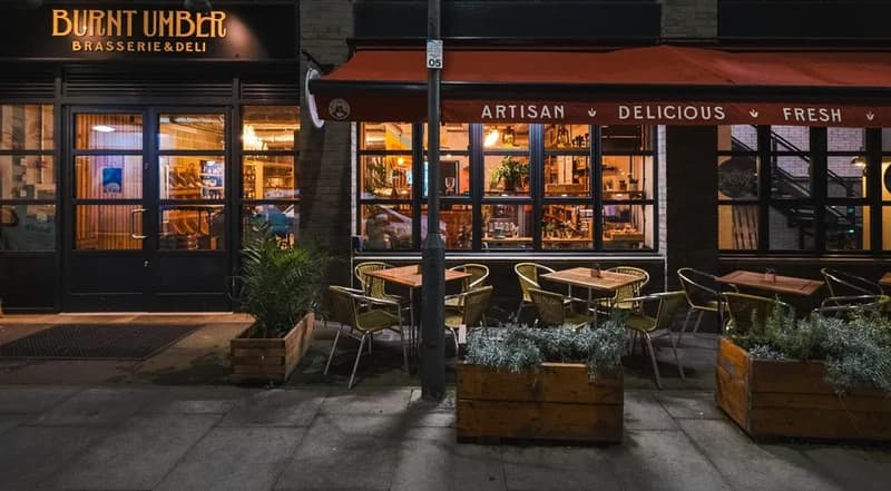 Front facade with outdoor seating at Burnt Umber Brasserie & Deli, London