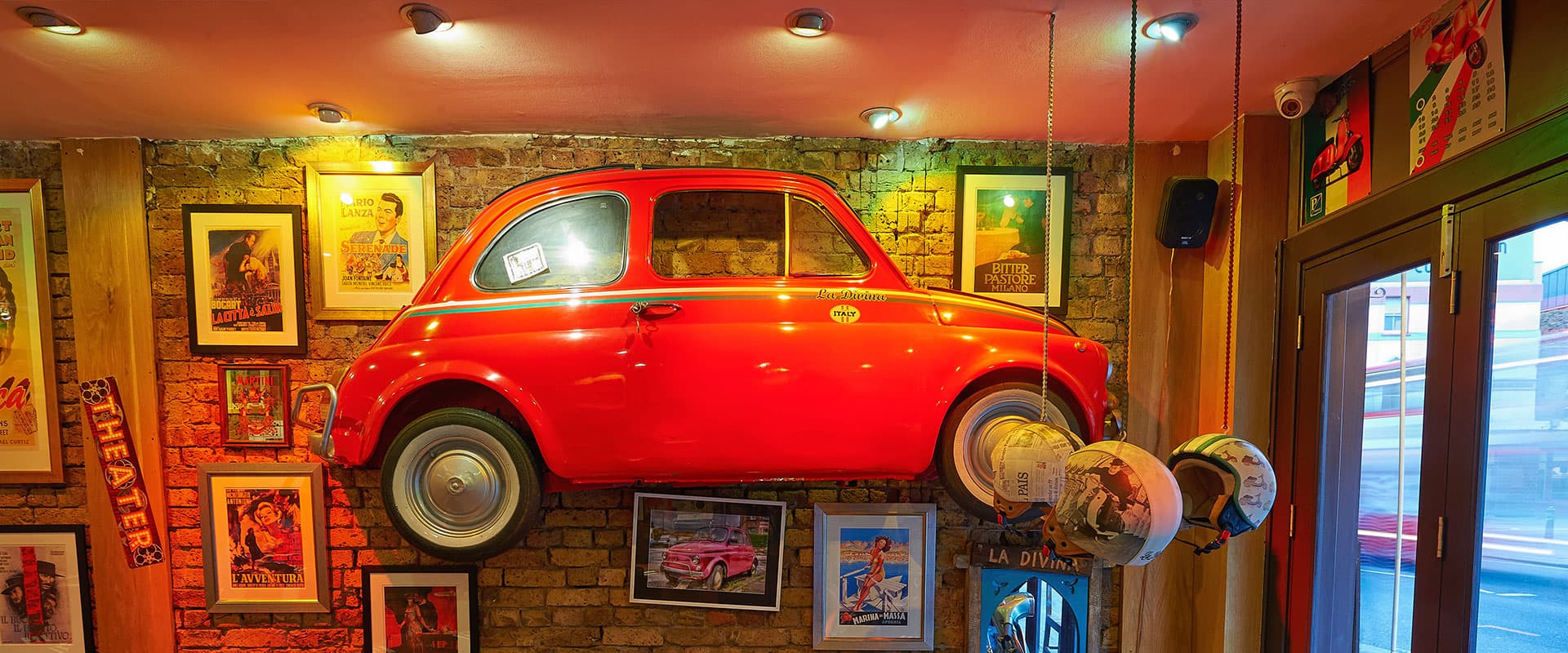 Vintage Fiat 500 wall feature at La Divina Italian Restaurant, London