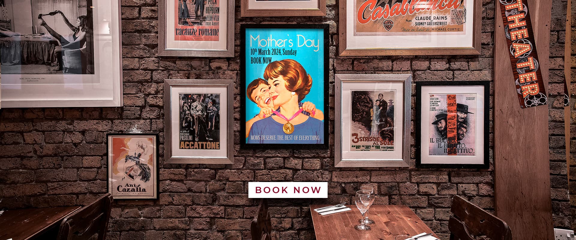 Vintage poster wall at La Divina Italian Restaurant, London