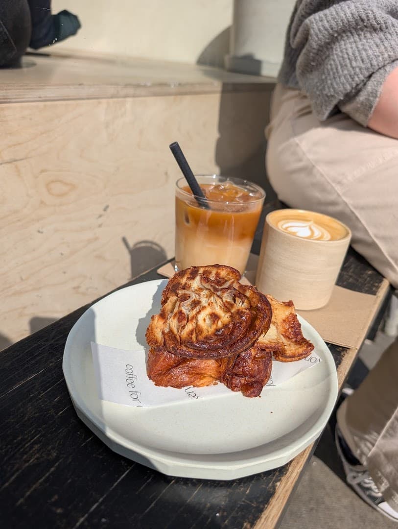 Cinnamon bun and coffee at Nola Coffee, London