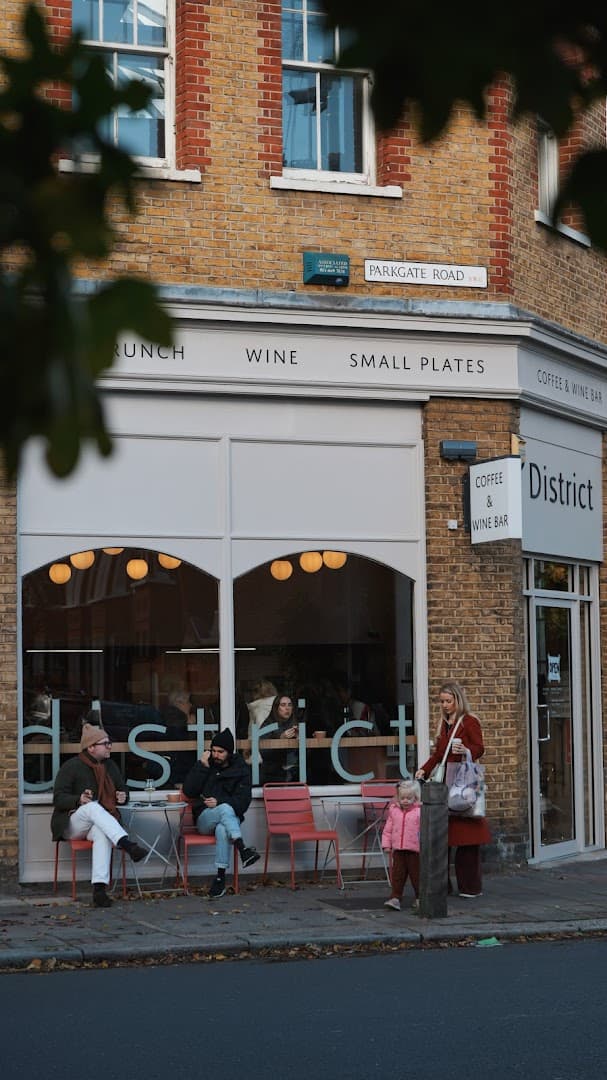 Front facade with outdoor seating at District - Battersea Park, London