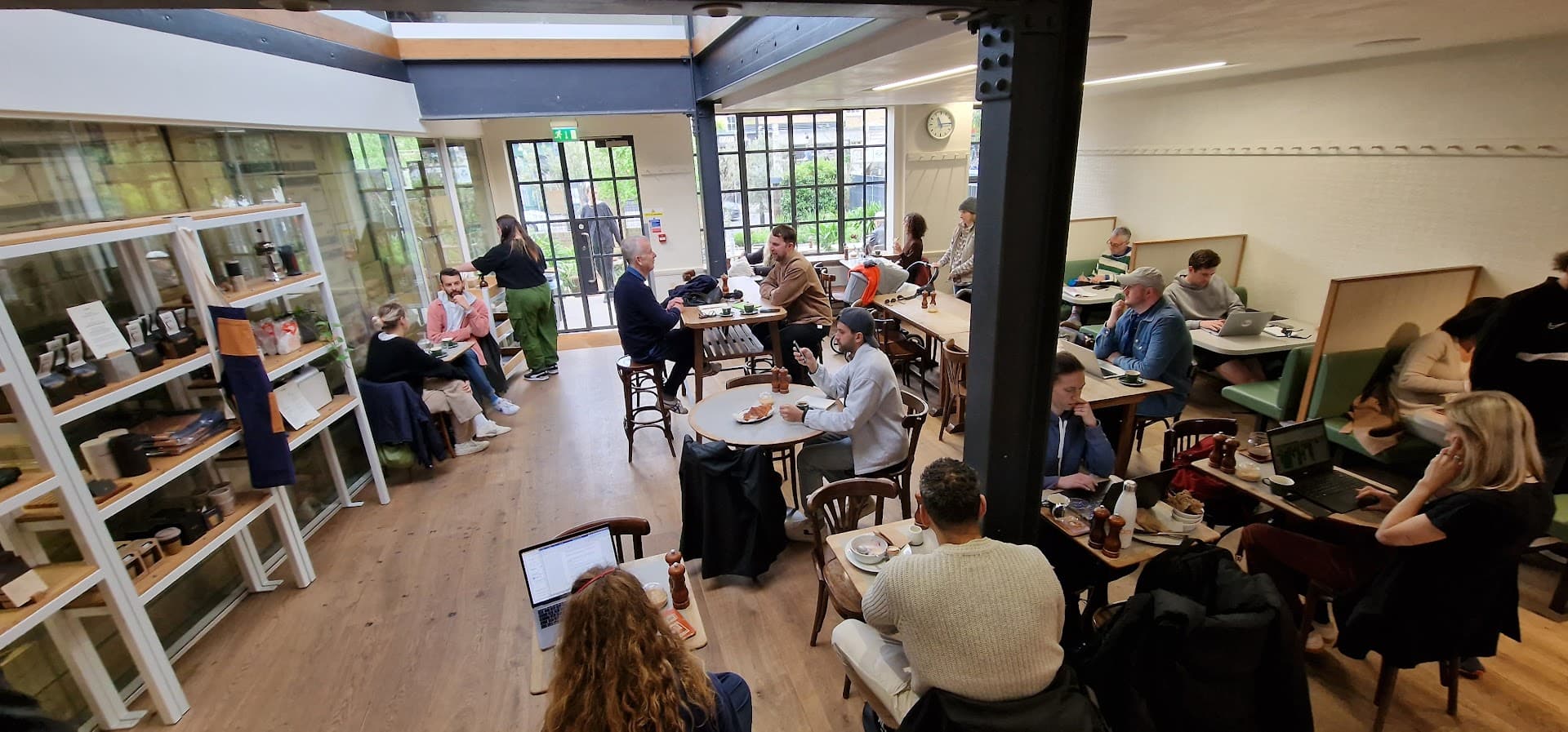 Busy café dining area at Allpress Espresso Roastery and Cafe, London