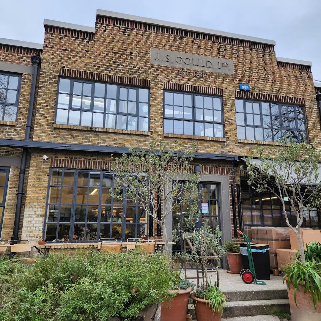 Front facade and courtyard garden at Allpress Espresso Roastery and Cafe, London