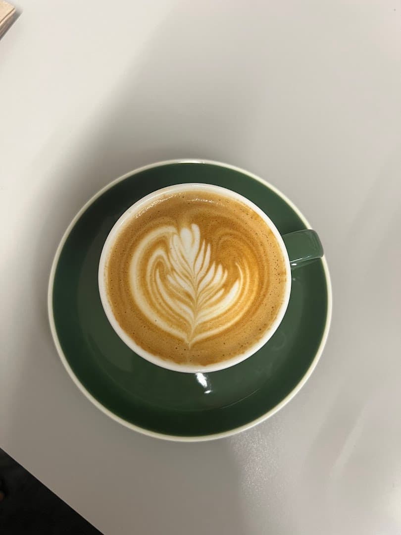 Latte art coffee at Allpress Espresso Roastery and Cafe, London