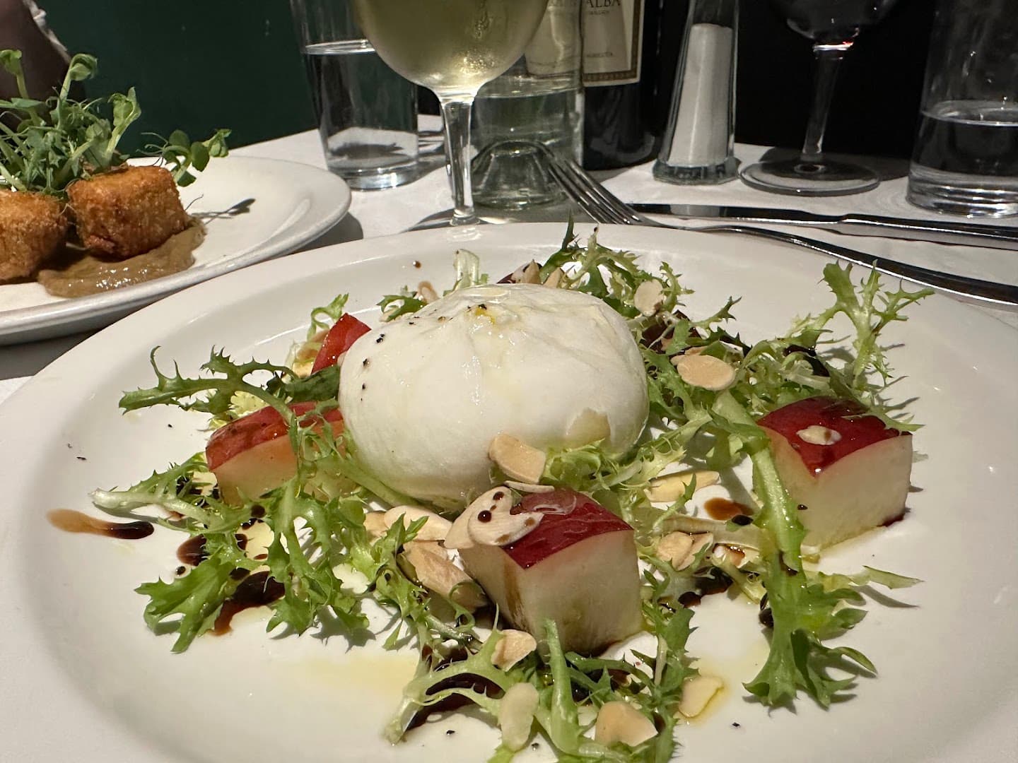 Burrata salad dish at Andrew Edmunds, London