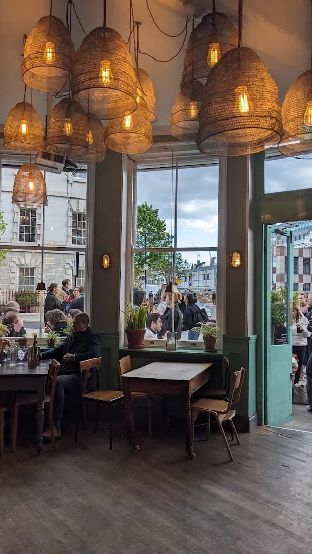 Dining room with statement woven pendant lights at The Green, London